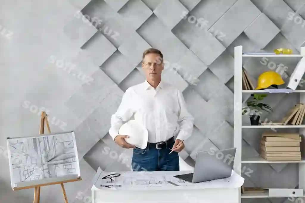 Medium shot me'mor ofisida o'z positsiyasini olayotgan | Medium shot architect posing his office