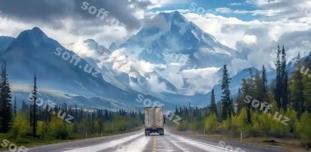 Yuk avtomobili to'g'ilik oldidagi yo'l bo'yi harakatlanmoqda. | Truck is driving down road front mountain range